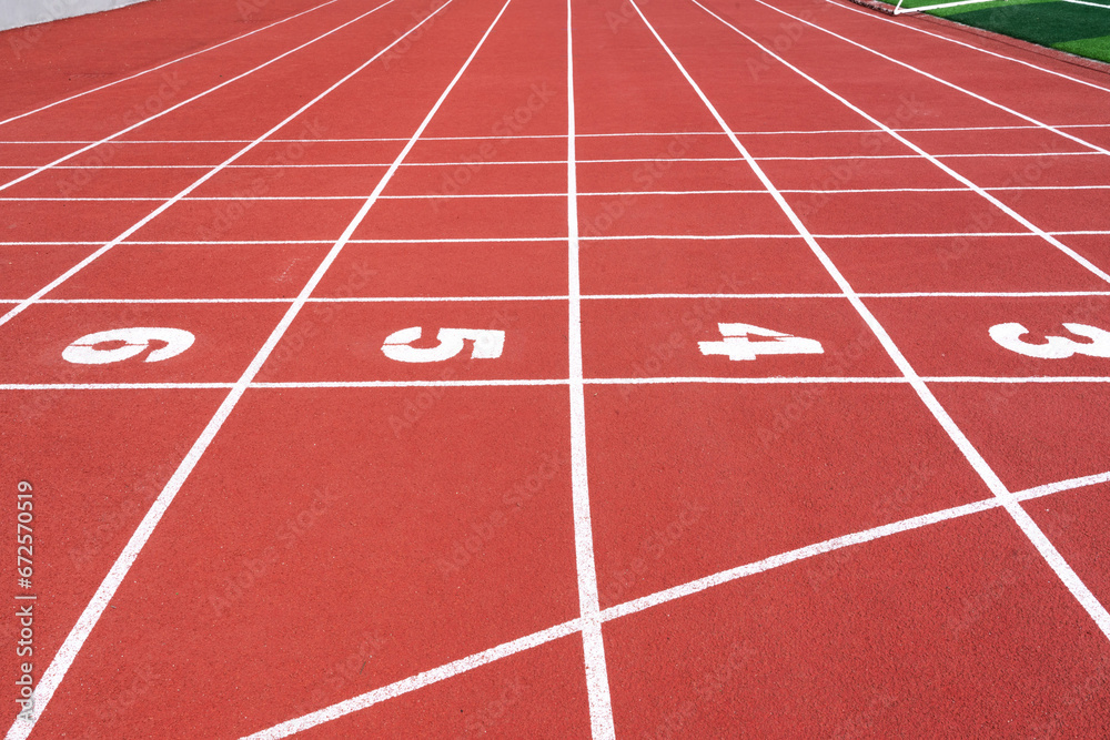 running track with lane numbers on the outdoor athletic stadium. people exercise or sport place.