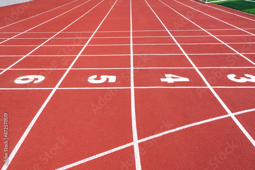running track with lane numbers on the outdoor athletic stadium. people exercise or sport place. © zhikun sun