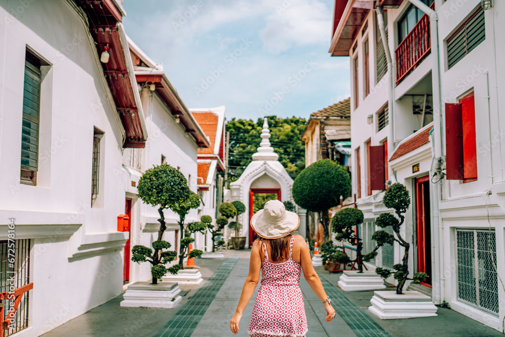 Naklejka premium Woman in old town in Bangkok 