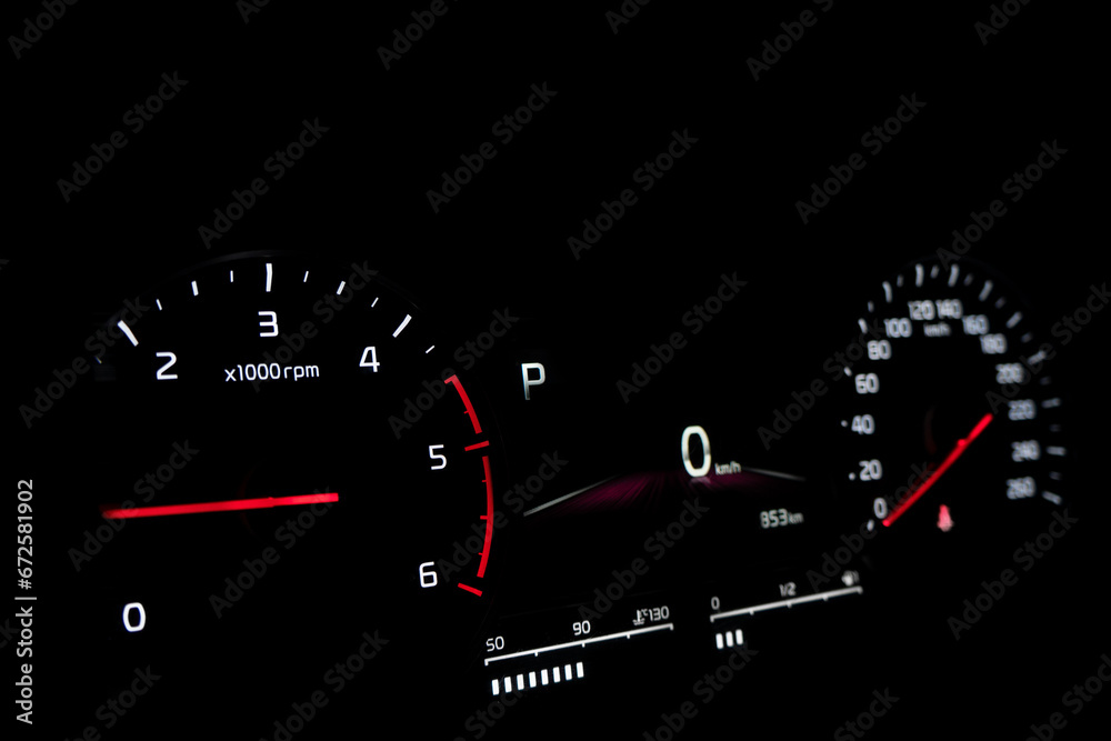Close up shot of speedometer in car. Car dashboard. Dashboard details with indication lamps.Car instrument panel. Dashboard with speedometer.