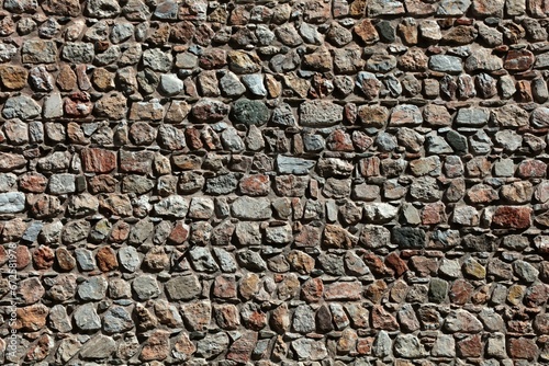 A wall made of rubble stones. Stone wall detail for backgrounds.