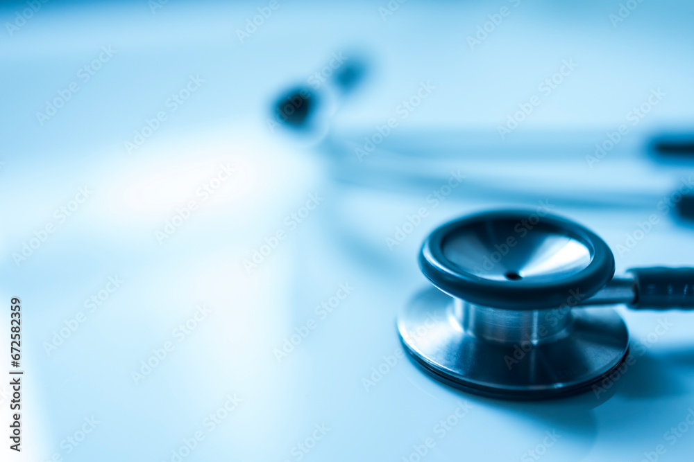 Medical stethoscope isolated on white blur background with copy space inside hospital.Close up photo of tool for doctor or veterinary use.Beautiful clipboard for text.Clean ear piece and tube. Medical stethoscope isolated on white blur background with copy space inside hospital.Close up photo of tool for doctor or veterinary use.Beautiful clipboard for text.Clean ear piece and tube.