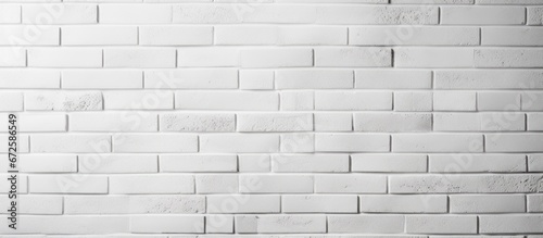 Textured background of a wall made of white bricks The surface of a room s white brick wall Background with a pattern of white brick wall