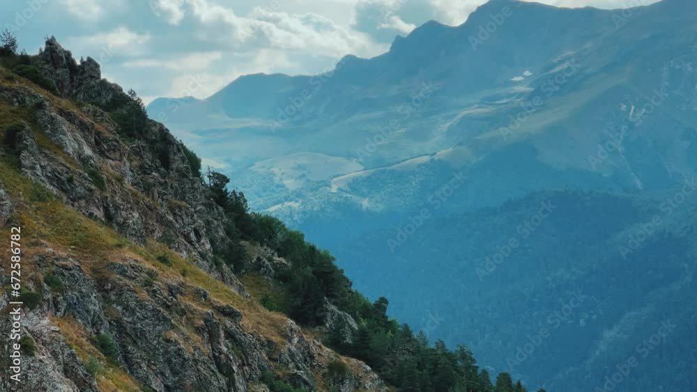 View of the mountain range near Mount Zakan. The top of the mountain node of the western part of the main ridge of the Greater Caucasus. Zakan Peak is the beginning of the Magisho mountain range. 4К View of the mountain range near Mount Zakan. The top of the mountain node of the western part of the main ridge of the Greater Caucasus. Zakan Peak is the beginning of the Magisho mountain range. 4К