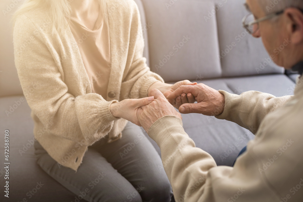 Fototapeta premium Close up anxious serious old man listening to female doctor at meeting in hospital, therapist physician consulting mature patient about disease, treatment, elderly generation healthcare concept