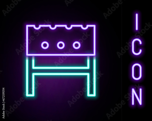 Glowing neon line BBQ brazier icon isolated on black background. Colorful outline concept. Vector