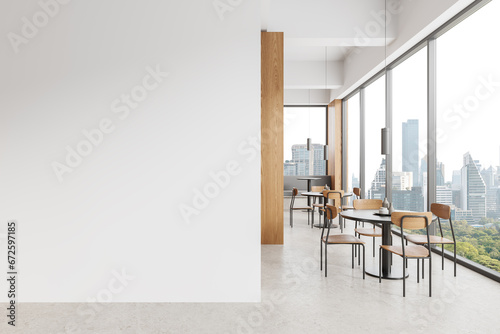 White and wooden cafe interior with blank wall photo