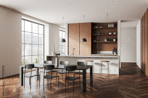 Stylish home kitchen interior with dining table, bar counter and window