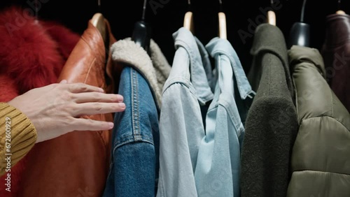 Customer touching clothes with hand 