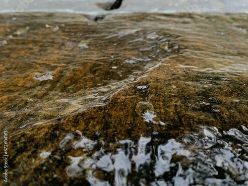 Wet rock on side of river, Rock wet with water