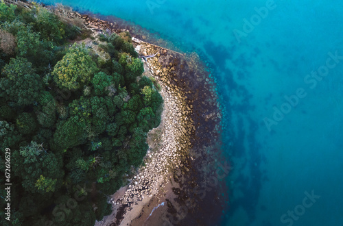 A birdseye view of a tropical seaside taken on a drone