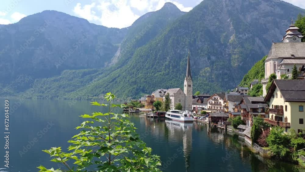 Beautiful Hallstatt mountain town in Austria in a sunny day. Beautiful Hallstatt mountain town in Austria in a sunny day.