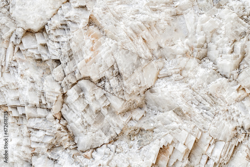 Crystals of mineral white Icelandic spar close-up, selective focus