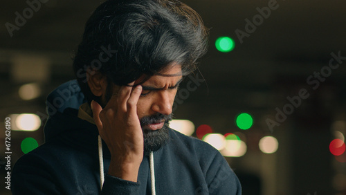 Εκτύπωση καμβά Close up stressed ill worried bad feeling unwell bearded Indian man take off gla