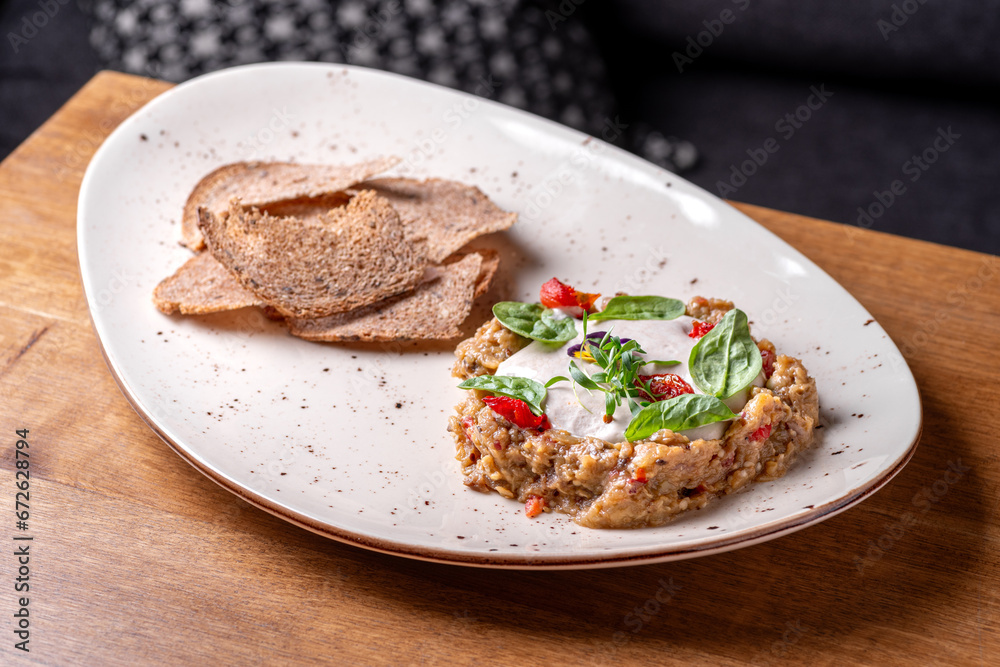Eggplant spread with truffle cream. Delicious. Dish serving in a restaurant, menu food concept