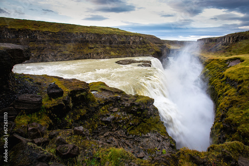 Golden waterfall called Gullfoss, the most powerful waterfall in Europe, Iceland.