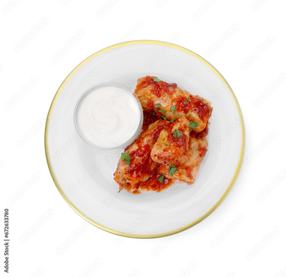 Plate of delicious stuffed cabbage rolls with sour cream isolated on white, top view Plate of delicious stuffed cabbage rolls with sour cream isolated on white, top view