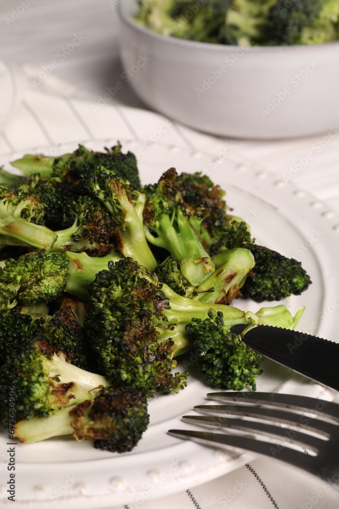Tasty fried broccoli served on white table, closeup Tasty fried broccoli served on white table, closeup