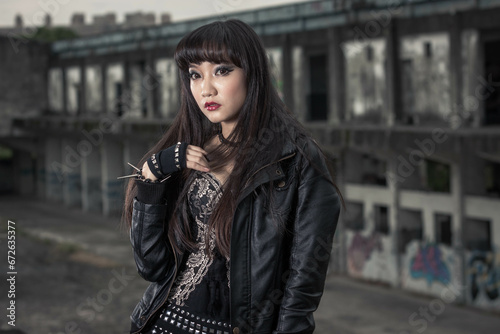 Canvas-taulu Asian woman in emo goth clothes at an abandoned building