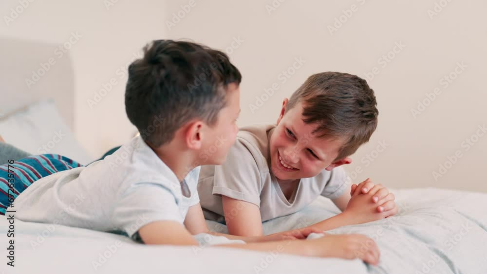 Children, laughing and conversation on bed, fun and silly jokes in discussion. Happy boys, kids and laughing for communication, bonding and love for siblings, kids and talking in bedroom at home Children, laughing and conversation on bed, fun and silly jokes in discussion. Happy boys, kids and laughing for communication, bonding and love for siblings, kids and talking in bedroom at home