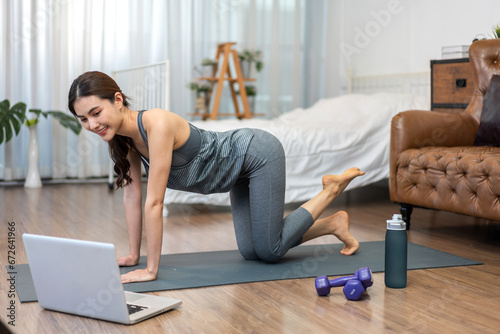 Portrait of sport slim fit strength asian woman training in sportswear sitting relax and practicing yoga, fitness, exercise, wellness, workout, sport at home.Diet concept.Fitness and healthy lifestyle