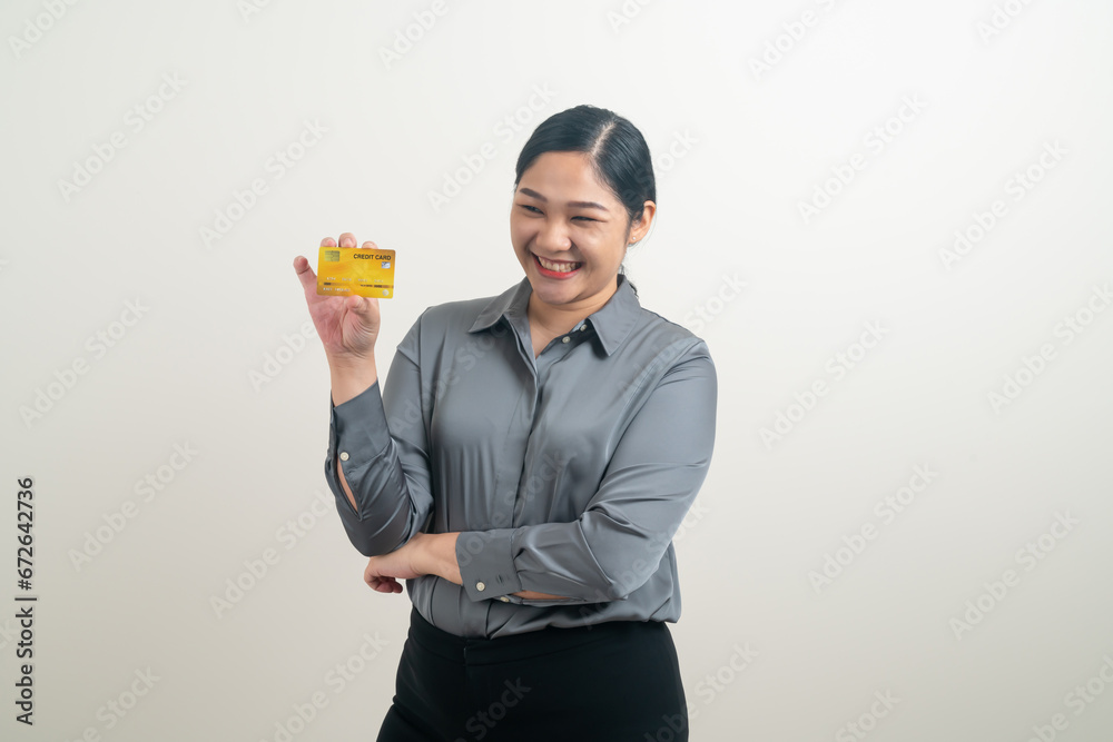 Asian woman holding credit card with white background Asian woman holding credit card with white background
