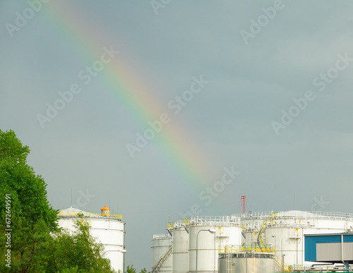 Rainbow over oil tanks