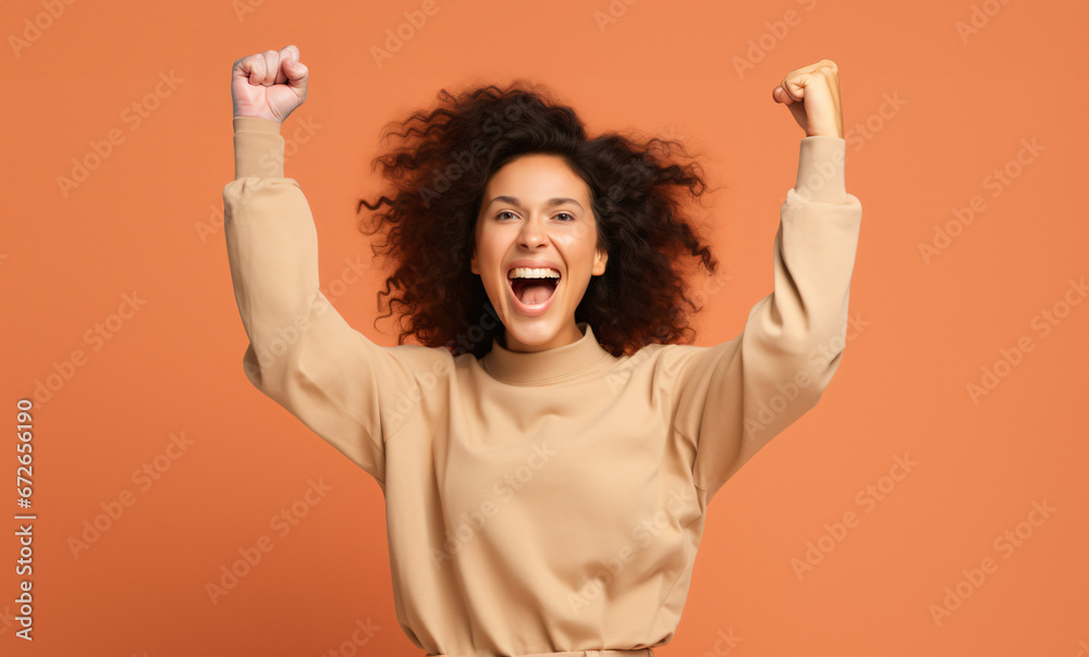 
Photo of cheerful overjoyed funny woman raise fists in victory see big bargains in phone isolated on beige color background - obrazy, fototapety, plakaty 