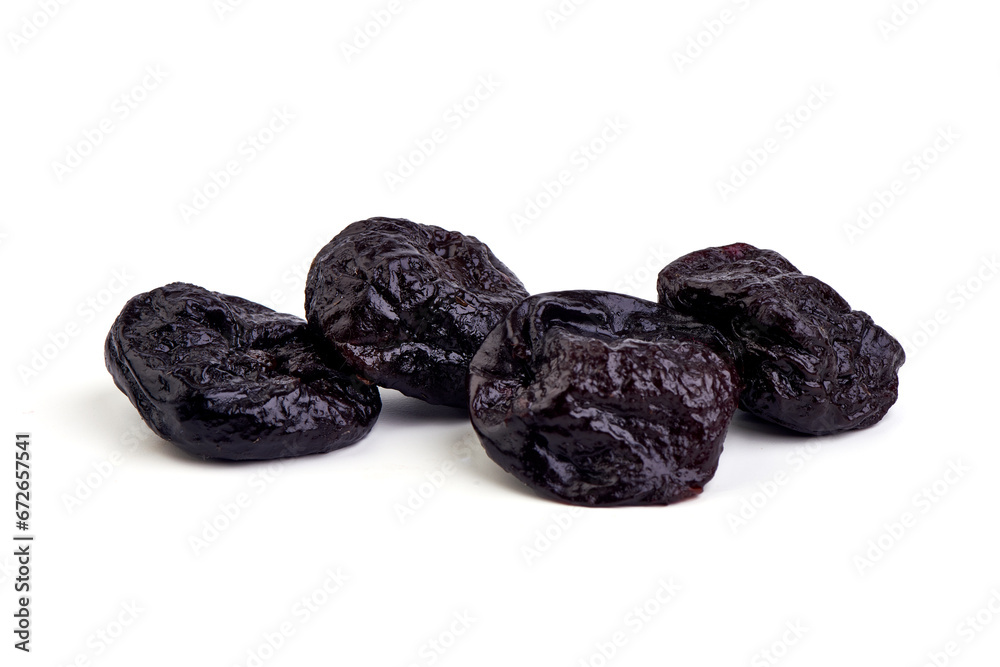 Prunes, dried fruits, close-up, isolated on white background. Prunes, dried fruits, close-up, isolated on white background.