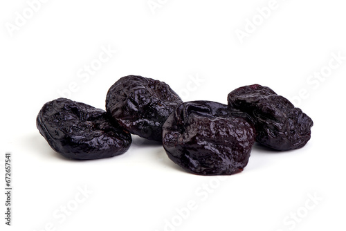 Prunes, dried fruits, close-up, isolated on white background.