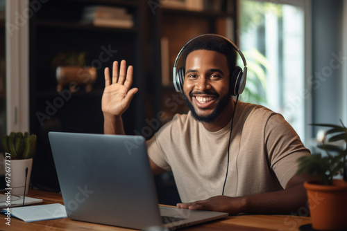 Smiling African American woman freelancer having video call working online from home, Young happy influencer recording video waving hand talking with subscribers