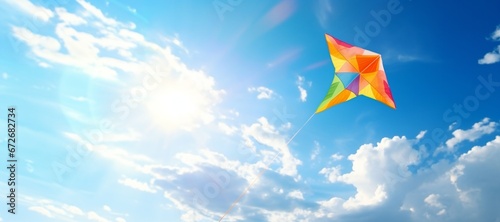 Colorful Kite Flying with Blue Sky, celebrating Green monday photo