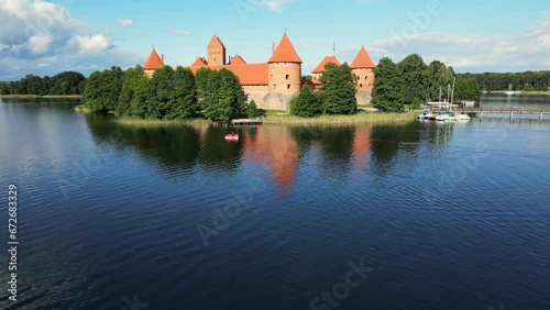 Aerial drone shot of red brick medieval castle on island in Trakai, Vilnius region, Lithuania. Trakai castle medieval gothic Island castle located in Galve lake. Most beautiful Lithuanian landmark