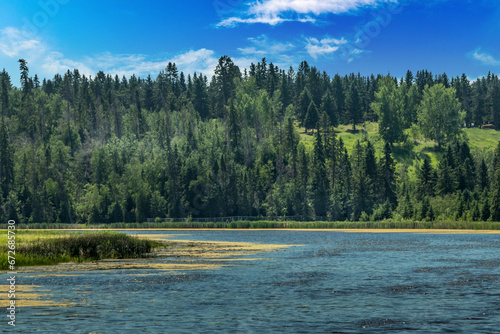 Birds art ponds trees and Red Deer River at Kerry Wood Natural Centre Red Deer County Alberta Canada