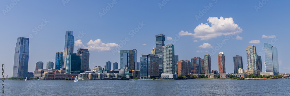 Naklejka premium Skyline view of Jersey City as seen from a boat on the Hudson river, New Jersey, USA