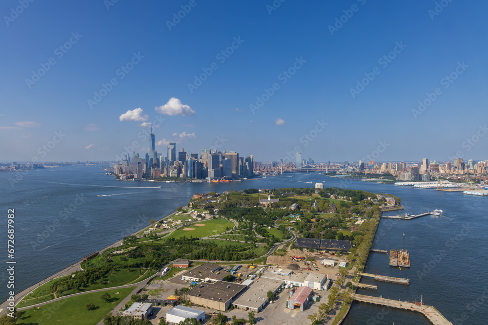 Aerial view of Governors Island with  Manhattan and Brooklyn in the background, New York City, USA - obrazy, fototapety, plakaty 