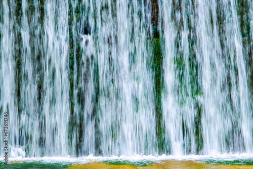 A beautiful view of the falling water cascade, Ciucaș Mountains, Romania