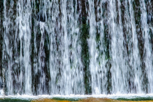 A beautiful view of the falling water cascade, Ciucaș Mountains, Romania