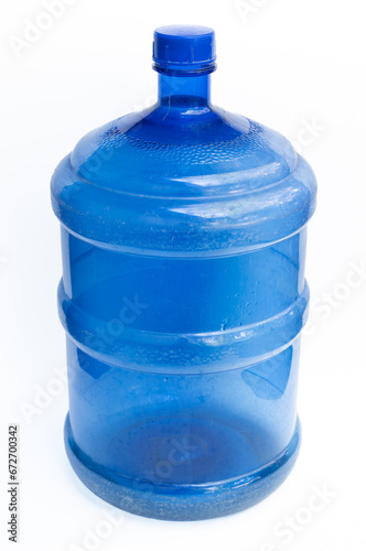 Hard plastic bucket with blue lid A large tank for holding water for use in daily household activities. Blue plastic bucket on white background.