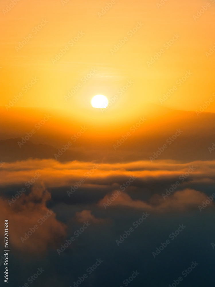 Sunrise over clouds