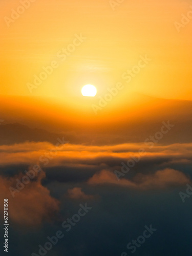 Sunrise over clouds © Conner