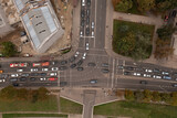 Drone photography of high traffic intersection near a park and construction site