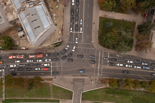 Drone photography of high traffic intersection near a park and construction site