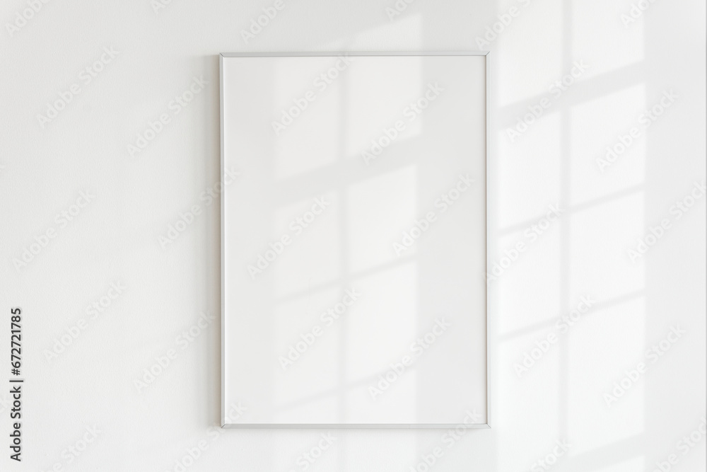 Blank frame on a wall with natural light Blank frame on a wall with natural light