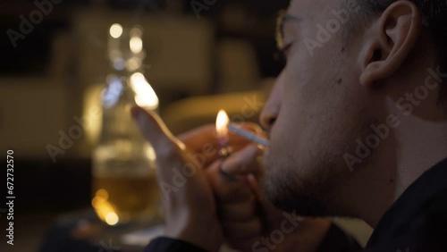 Young man smoking marijuana.