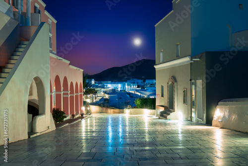 view of the village of Oia and the Greek island of Santorini on a warm summer evening