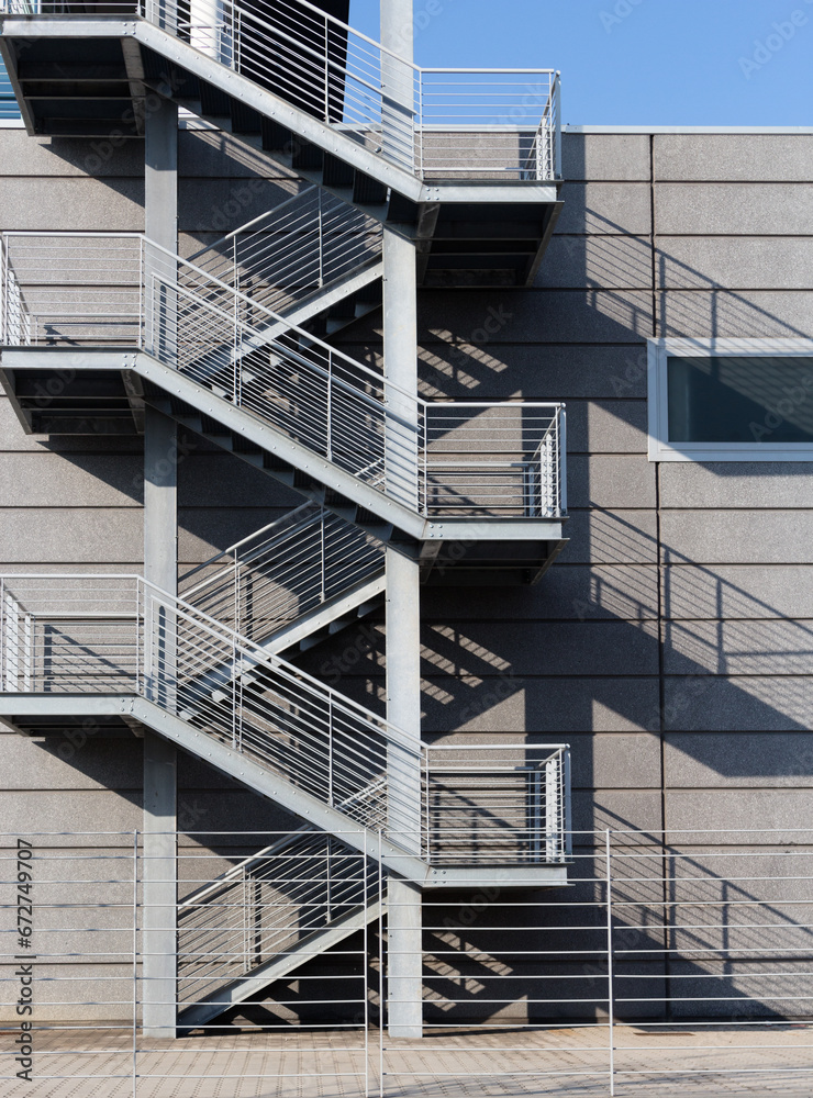 Fototapeta premium Steel emergency stairs in a building