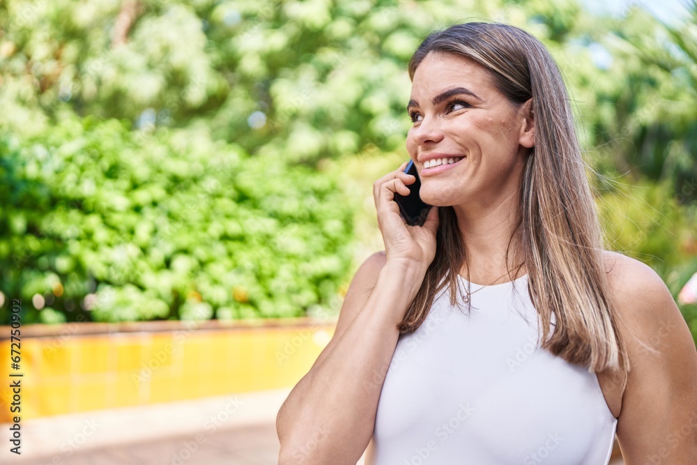 Young beautiful hispanic woman smiling confident talking on the smartphone at park Young beautiful hispanic woman smiling confident talking on the smartphone at park