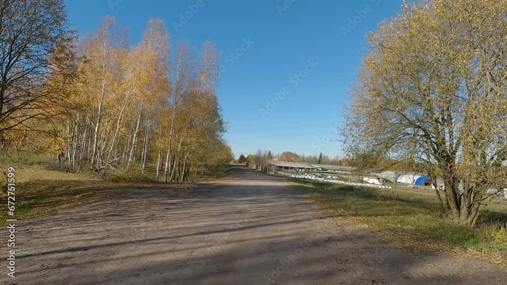 The car drives along the road on a autumn day. Highways, roadside and road line markings. The car drives along the road on a autumn day. Highways, roadside and road line markings.