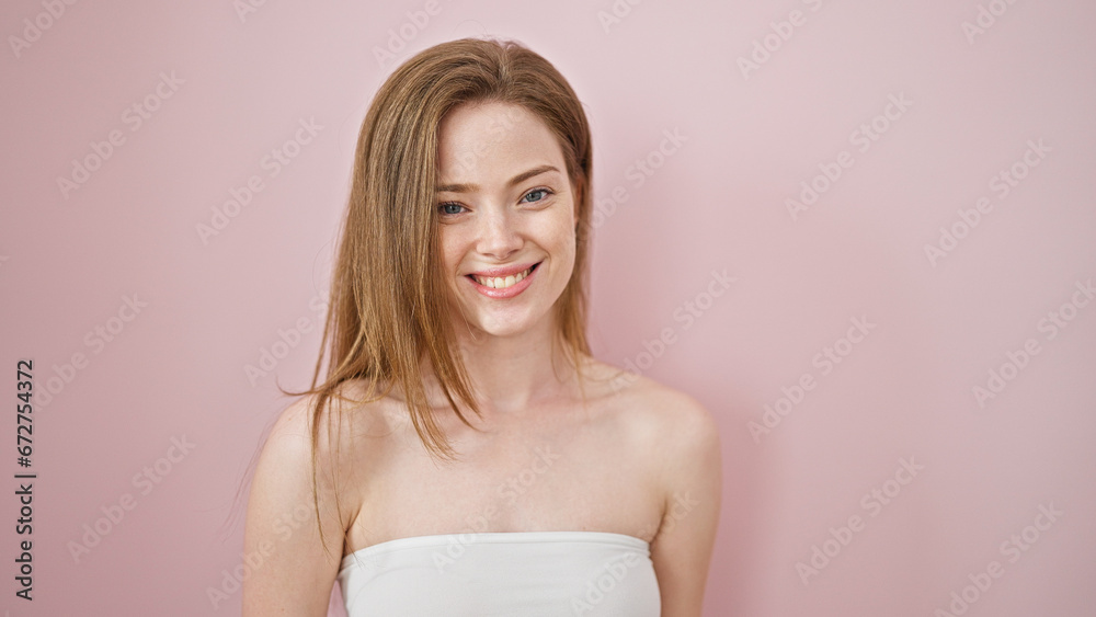 Young blonde woman smiling confident standing over isolated pink background Young blonde woman smiling confident standing over isolated pink background